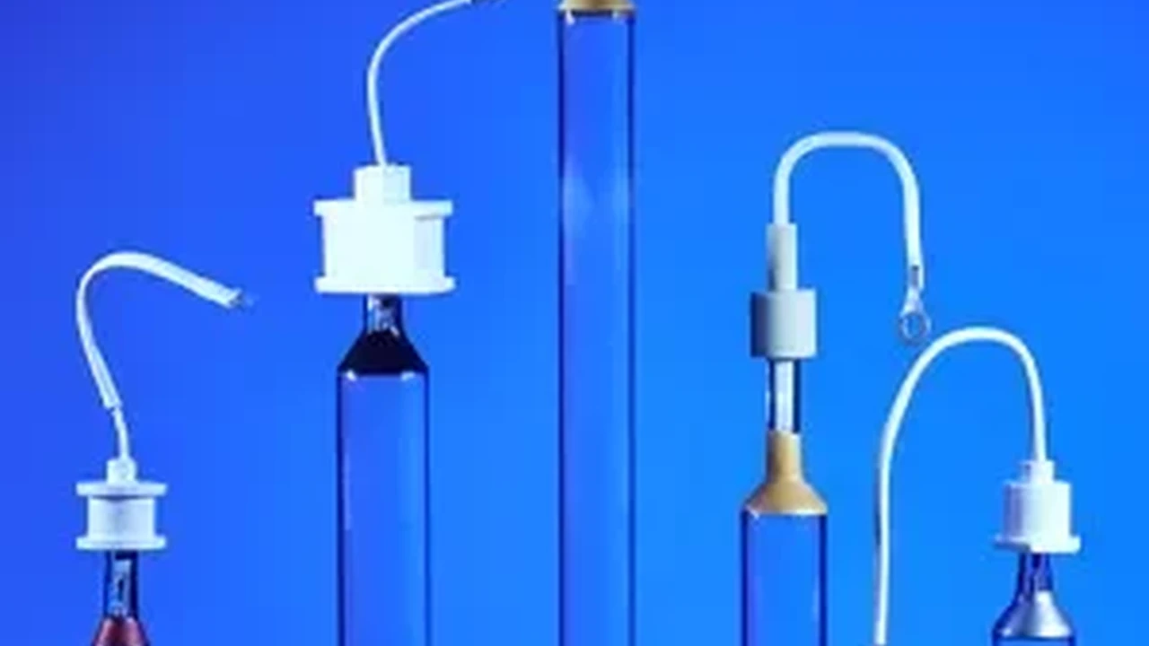 Two mint chocolate milkshakes with whipped cream and green sprinkles.