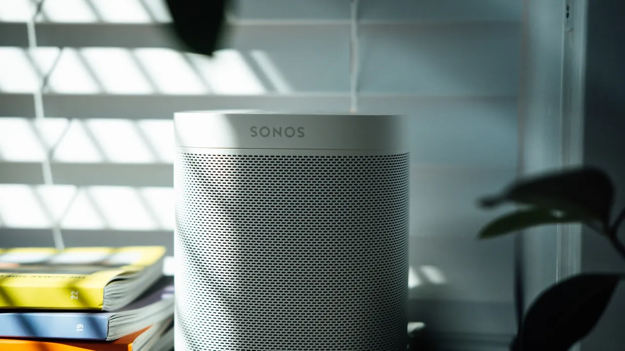 Close up on a plate of mashed potatoes, topped with baked pork chops with cream of mushroom soup, and a side of green beans.