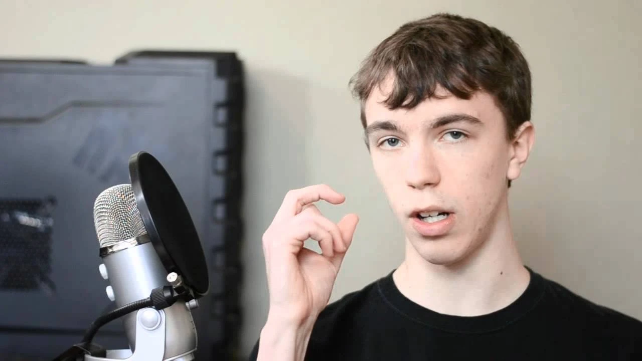 Two mint chocolate milkshakes with whipped cream and green sprinkles.